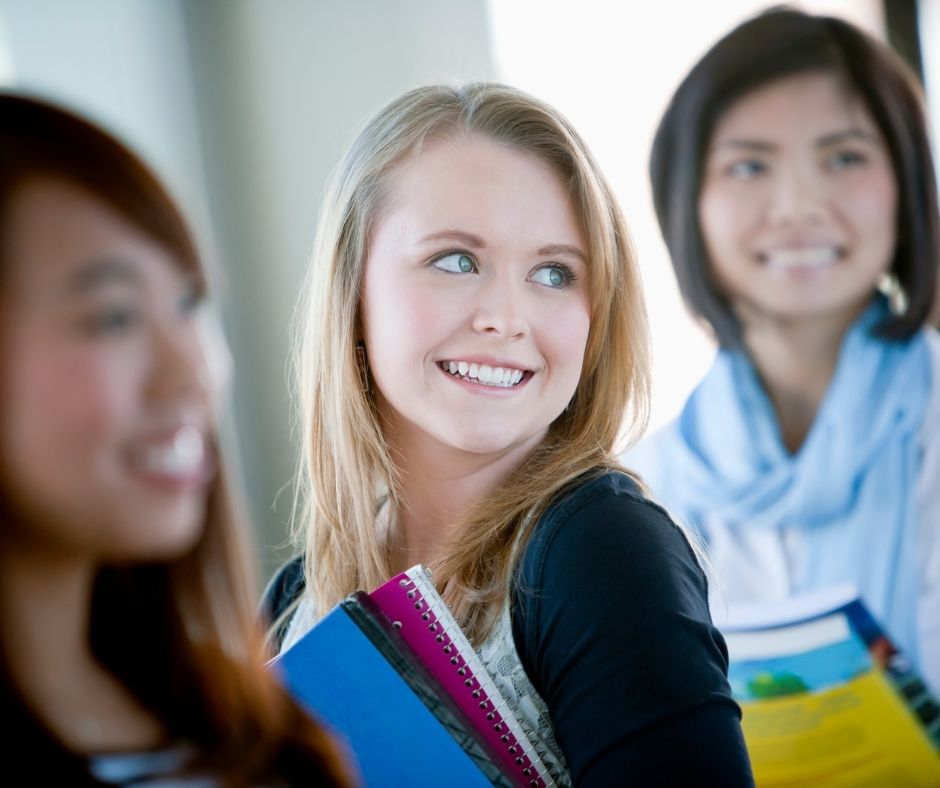 3 girls students smiling