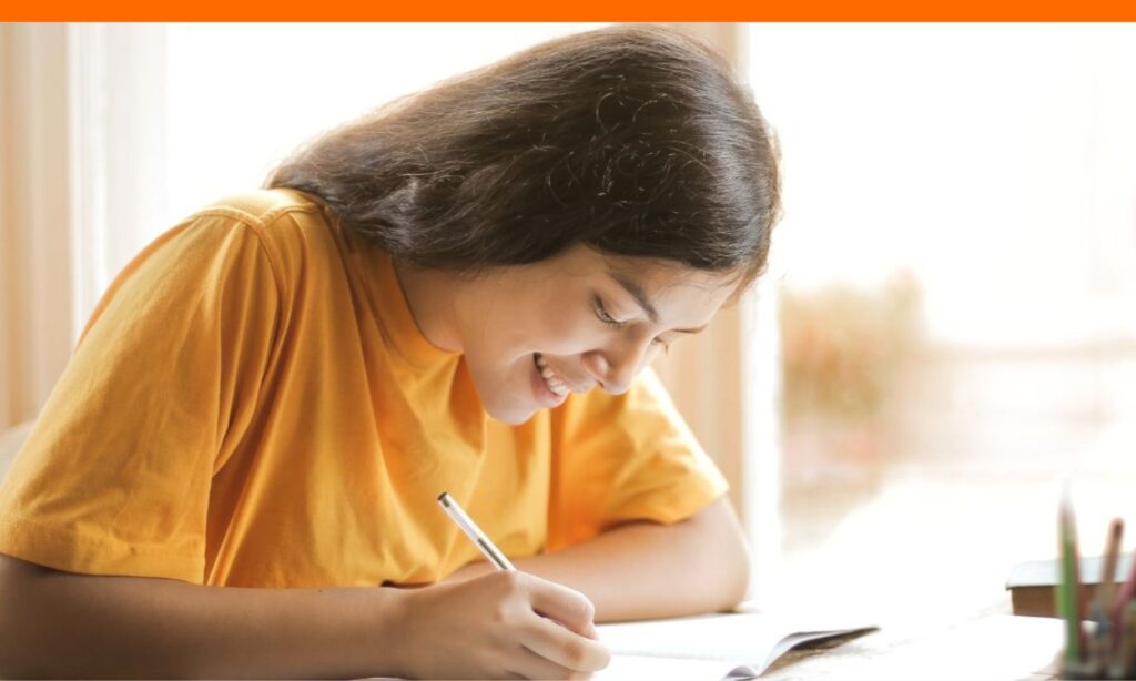 Teen girl writing scholarship thank you notes