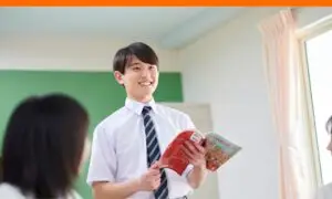 Teen boy actively participating in class