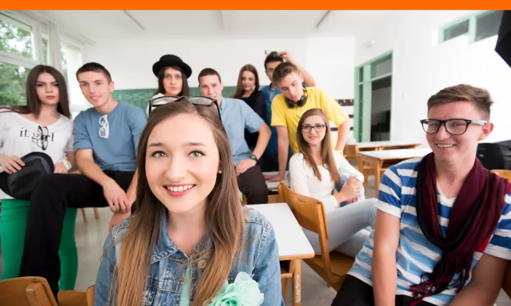 happy students at their desks celebrating rhode island scholarship wins