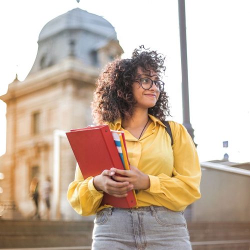 Girl student in front of her college