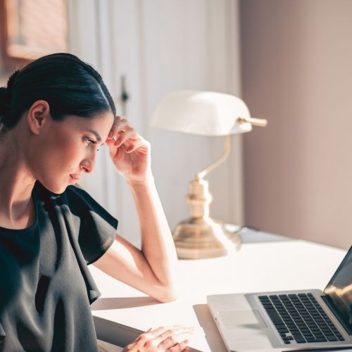 Woman admission officer checking college essays