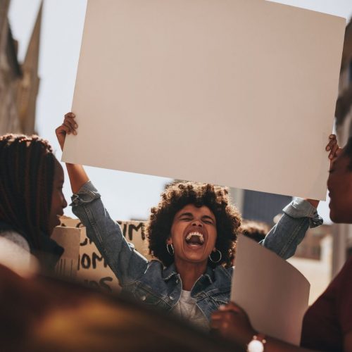 girl with afro hair protesting