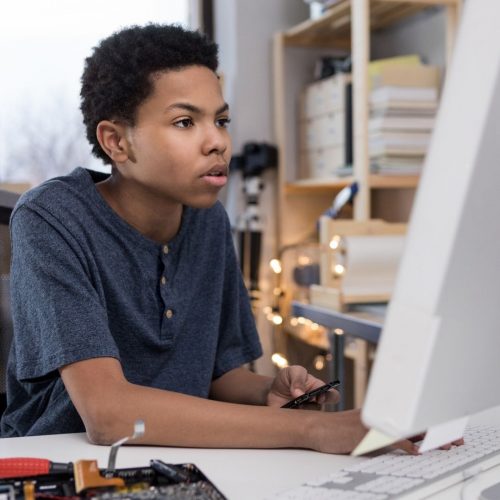 boy studying in his computer