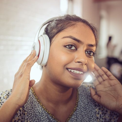 girl listening music in her earphone