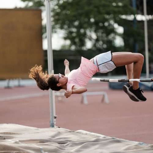 girl jumping the bar