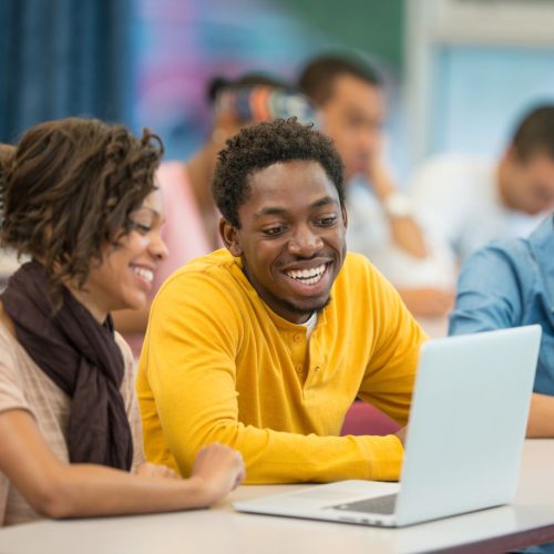 fafsa age limit boy and girl smiling at computer