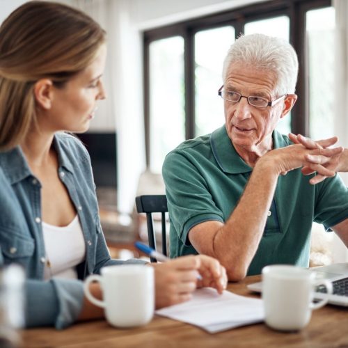 man and woman discussing financial aid package