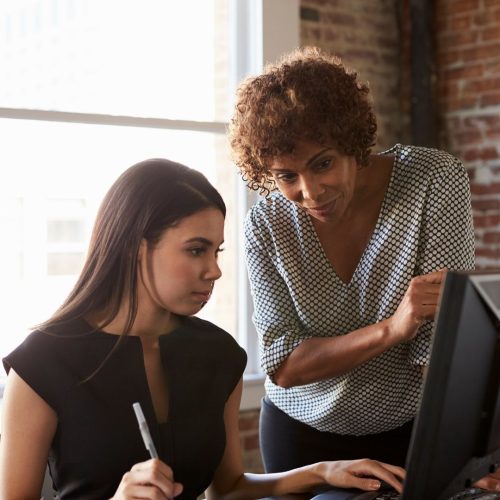 weighted vs. unweighted GPA Girls looking at computer