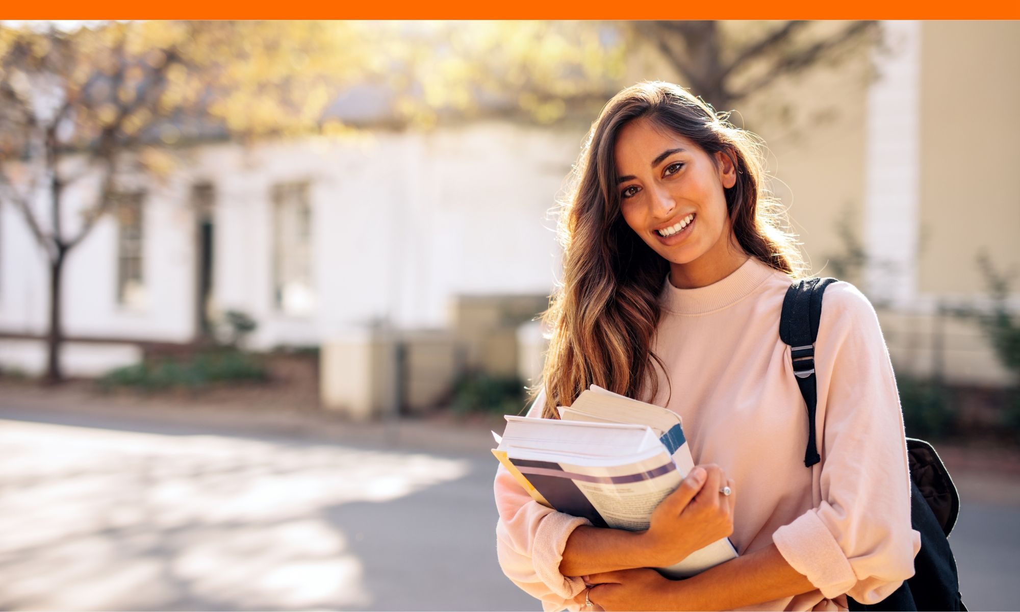 College student walking with books