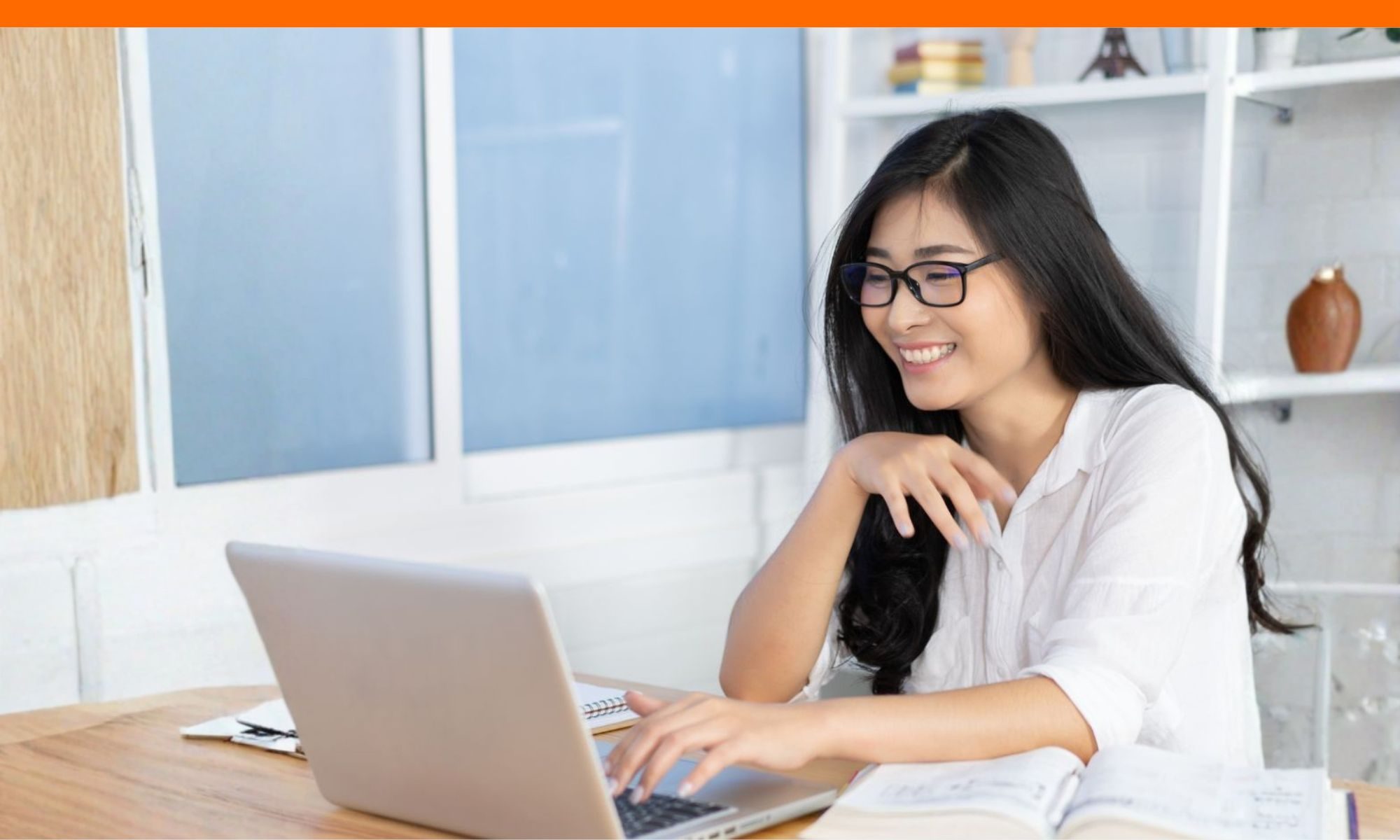 Happy student completing college applications