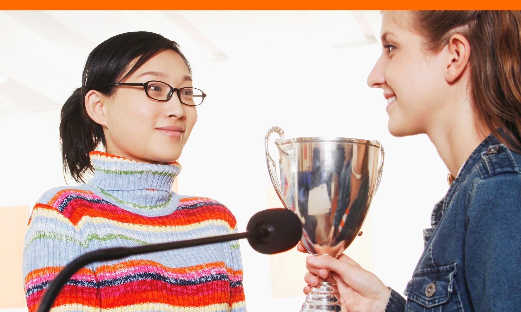 teen girl receiving an award that she can share in loci after deferral