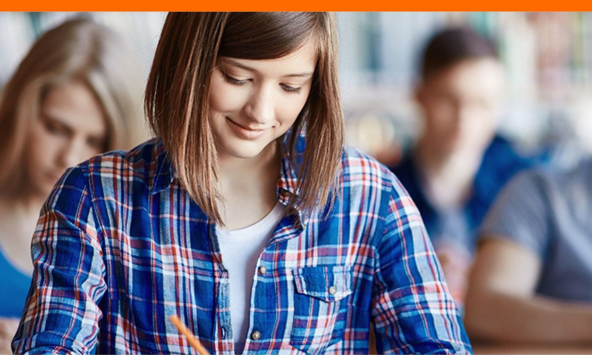 teen-girl-working-on-college-application-at-desk